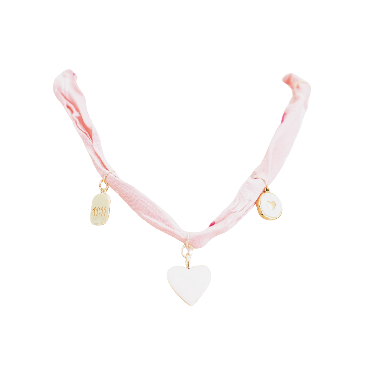 A pink ribbon choker necklace with gold-tone hardware, featuring a large white heart pendant in the center and two smaller decorative charms on either side, shown against a plain white background.