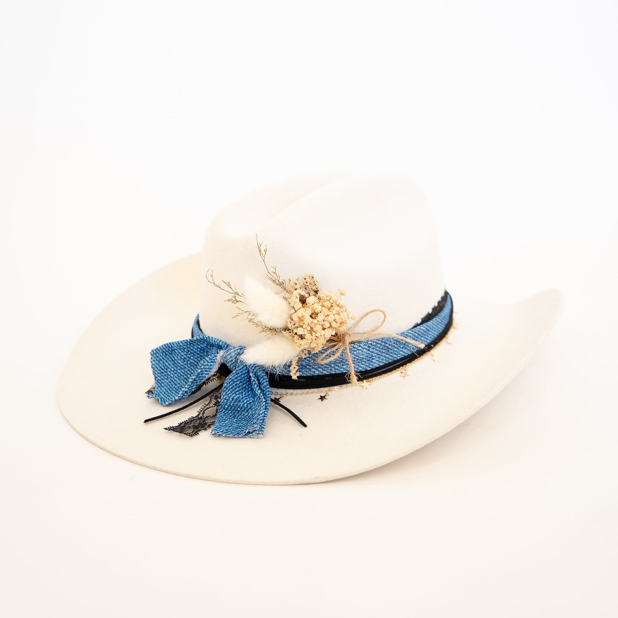 White sun hat with blue decorative elements on a white background
