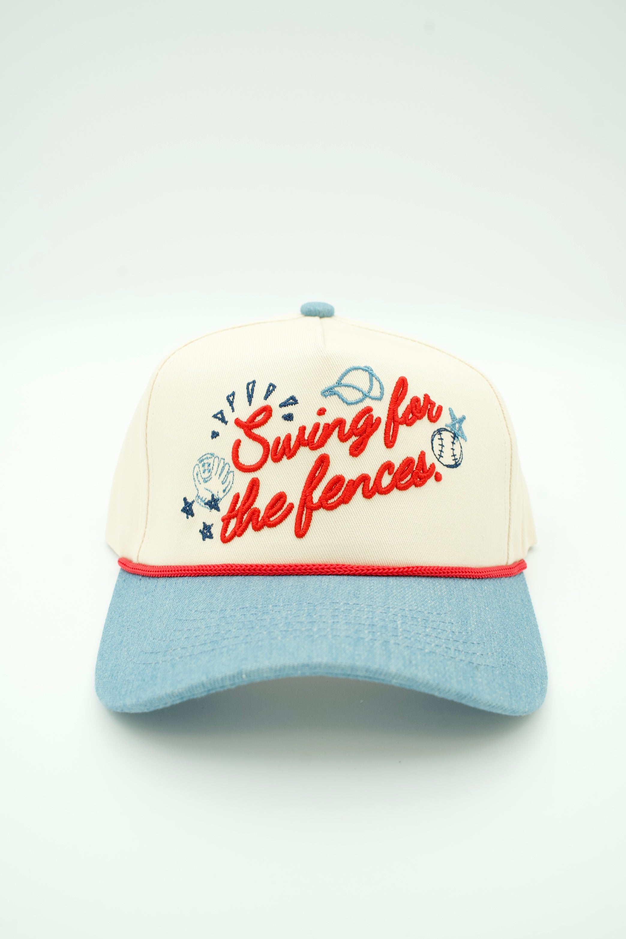 A baseball cap with an off-white crown, light blue visor, and red embroidered text reading 'Swing for the fences' with baseball-themed doodles, shown on a light gray background.