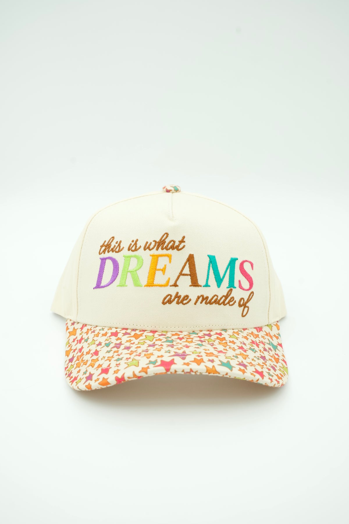 Front image of This Is What Dreams Are Made Of canvas trucker hat with multi colored stars on the bill