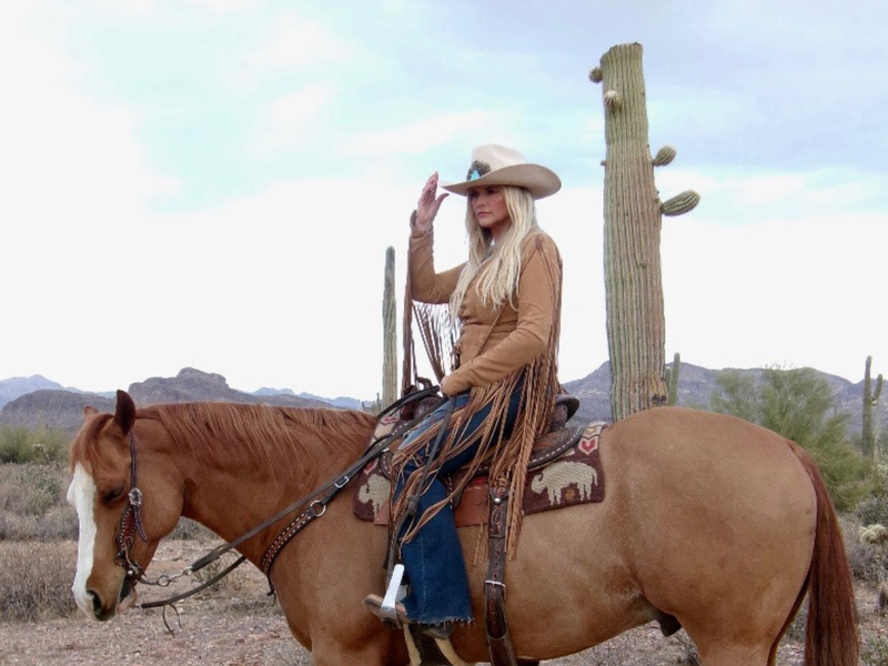 Country star Miranda Lambert posing on horseback in her custom Rancher Hat Bar cowboy hat during private photoshoot
