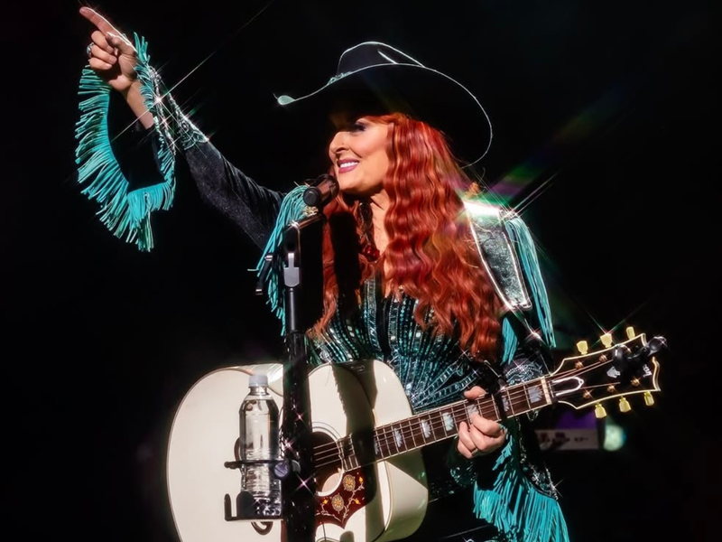  Wynonna Judd wearing her custom Rancher Hat Bar cowboy hat on stage during her concert