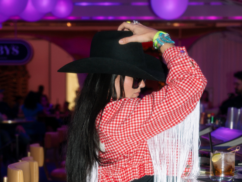 Lifestyle creator Amanda Haradon poses wearing her a custom Rancher Hat 