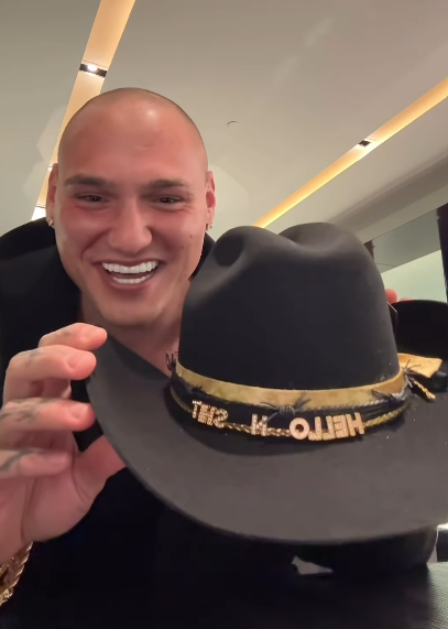 Leo Skepi posing with the received a customized a Rancher Hat while staying at the Cosmopolitan in Las Vegas