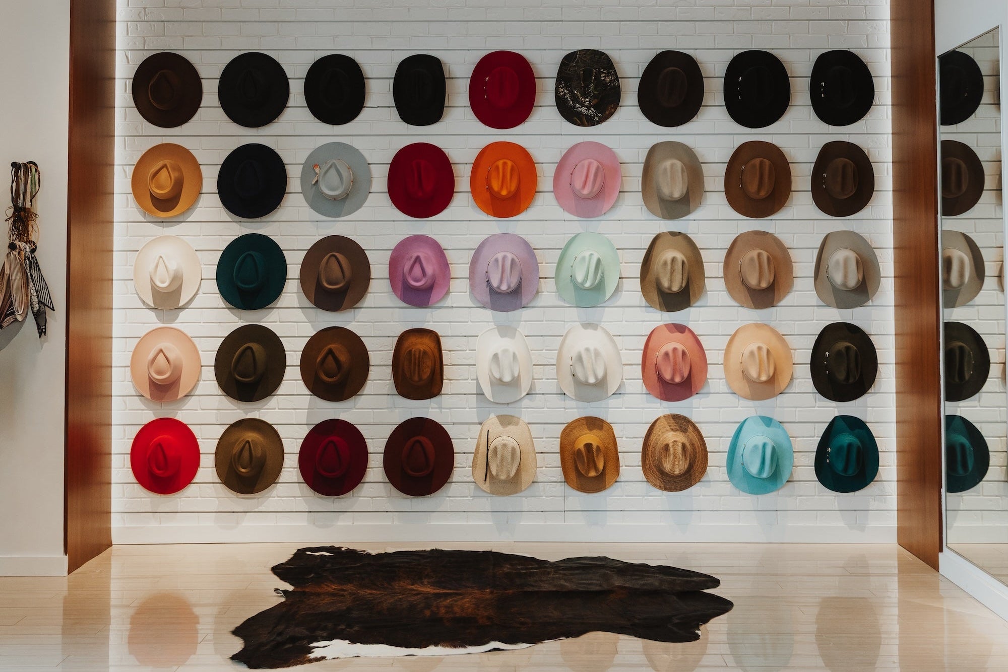 Wall display of various hats in a store setting