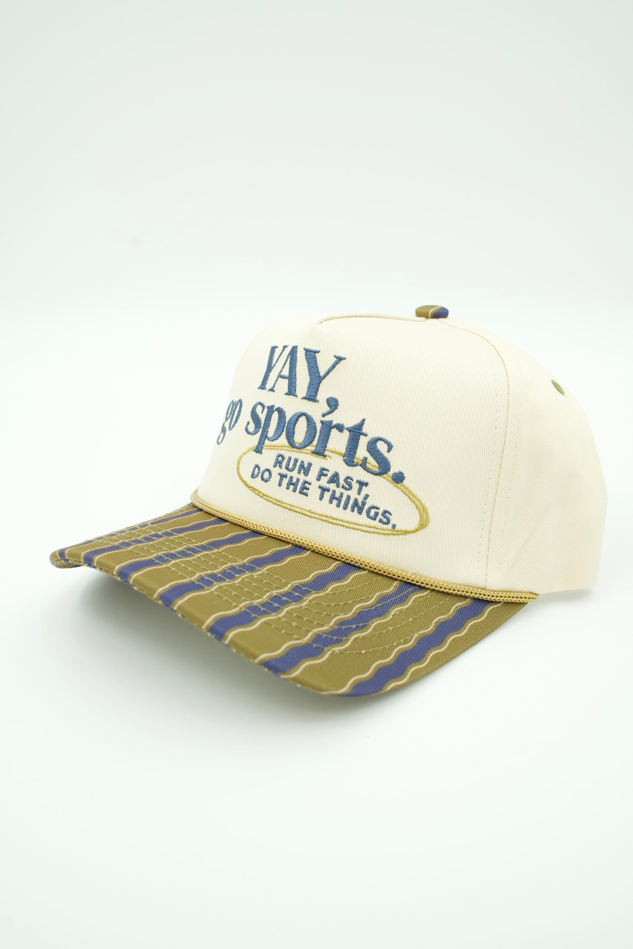 An off-white baseball cap with blue embroidered text reading 'Yay go sports. RUN FAST, DO THINGS'